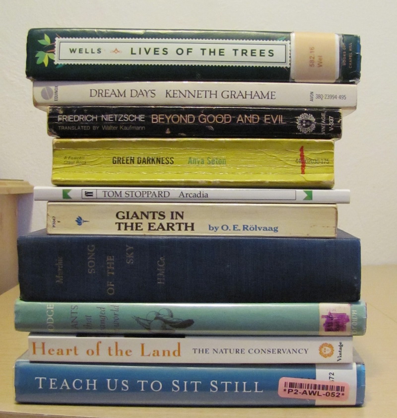 Stack of books with titles that make up the poem.