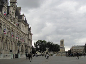 The Hôtel de Ville of Paris is on the left in this photo, and the towers of Notre Dame are visible in the background, across the river.